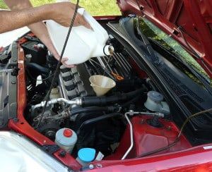 bigstock-Adding-Motor-Oil-To-Car-22372964