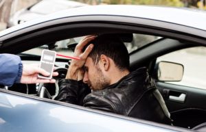 this is a photo of a man who has failed his car breathalyzer test